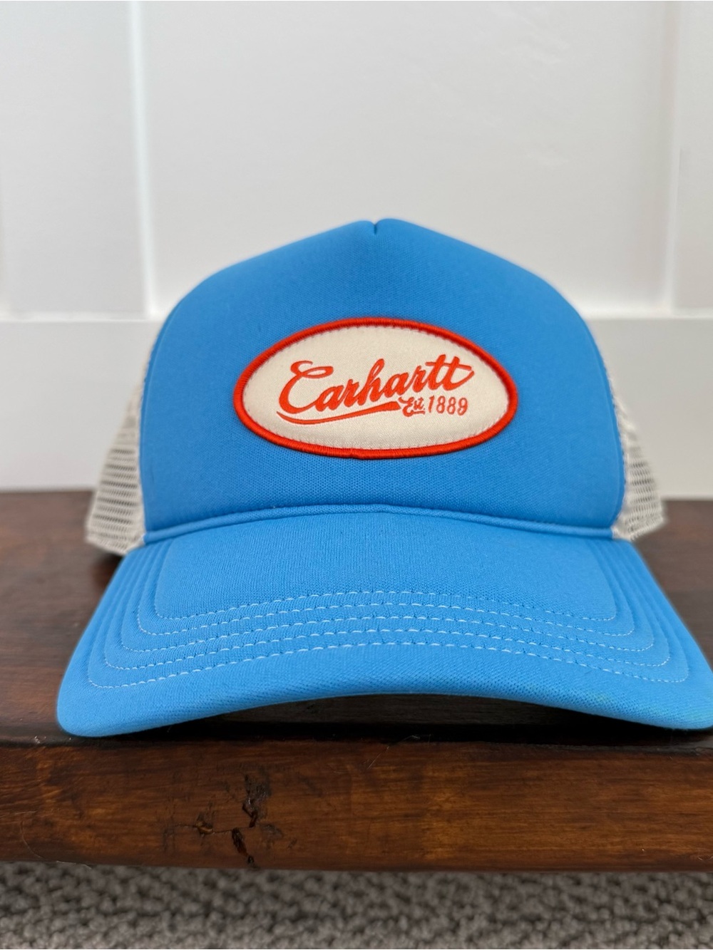 Carhartt Blue Trucker Hat with Cream Patch and Orange Trim